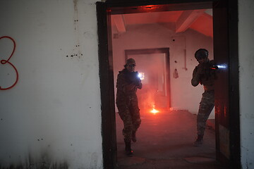 Image showing military troops in action urban environment