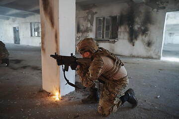 Image showing military troops in action urban environment