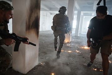 Image showing Videographer Taking Action Shoot of Soldiers in Action urban environment