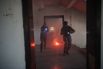 Image showing military troops in action urban environment