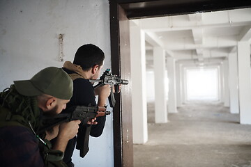 Image showing military troops in action urban environment