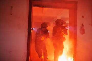 Image showing military troops in action urban environment