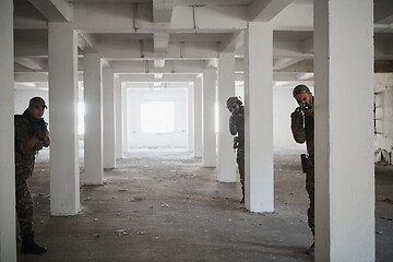 Image showing military troops in action urban environment