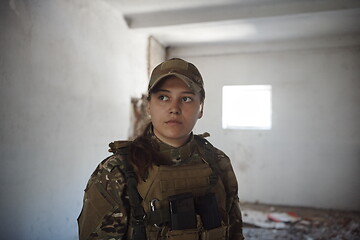 Image showing military female soldier having a break