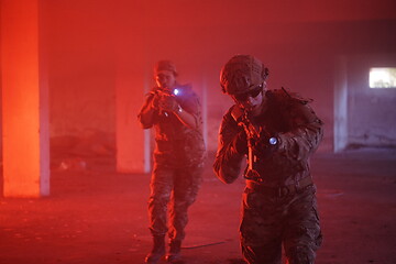Image showing military troops in action urban environment