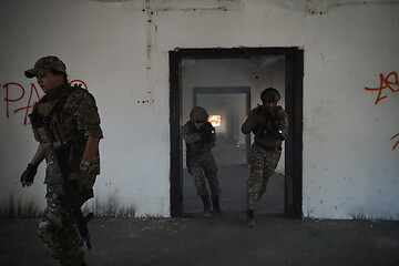 Image showing military troops in action urban environment