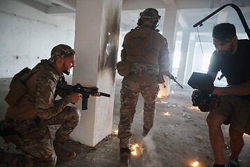 Image showing Videographer Taking Action Shoot of Soldiers in Action urban environment