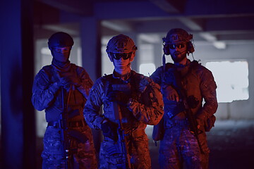 Image showing soldier squad team portrait in urban environment colored lightis