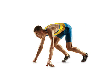 Image showing Young caucasian man running or jogging isolated on white studio background.