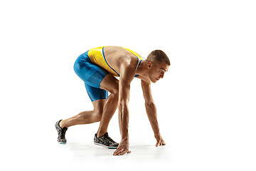 Image showing Young caucasian man running or jogging isolated on white studio background.