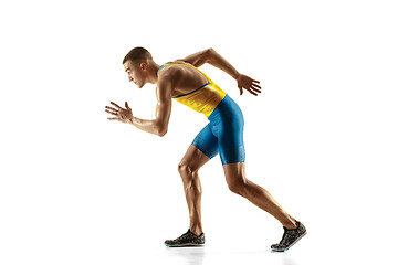 Image showing Young caucasian man running or jogging isolated on white studio background.