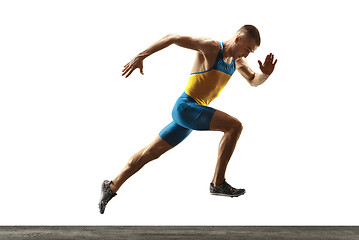 Image showing Young caucasian man running or jogging isolated on white studio background.