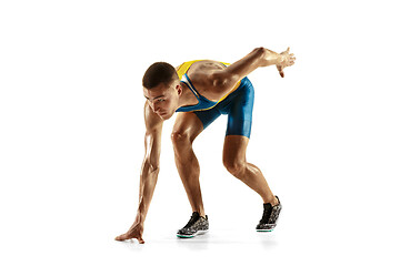 Image showing Young caucasian man running or jogging isolated on white studio background.