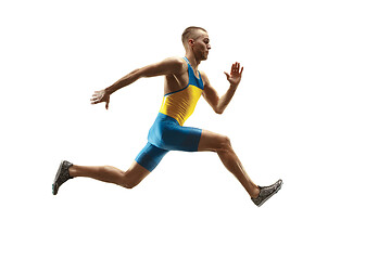 Image showing Young caucasian man running or jogging isolated on white studio background.