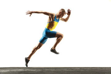 Image showing Young caucasian man running or jogging isolated on white studio background.