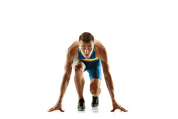 Image showing Young caucasian man running or jogging isolated on white studio background.