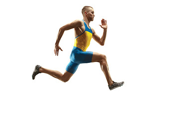 Image showing Young caucasian man running or jogging isolated on white studio background.