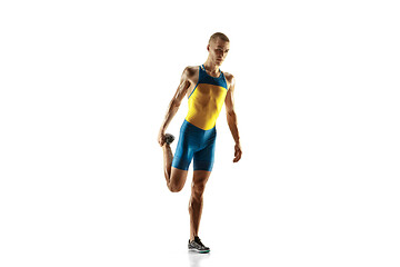 Image showing Young caucasian man running or jogging isolated on white studio background.