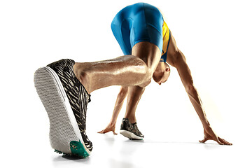 Image showing Young caucasian man running or jogging isolated on white studio background.