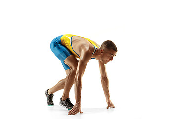 Image showing Young caucasian man running or jogging isolated on white studio background.