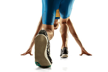 Image showing Young caucasian man running or jogging isolated on white studio background.