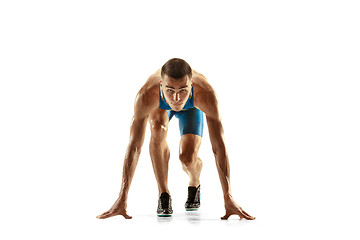 Image showing Young caucasian man running or jogging isolated on white studio background.