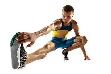 Image showing Young caucasian man running or jogging isolated on white studio background.