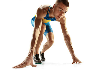 Image showing Young caucasian man running or jogging isolated on white studio background.