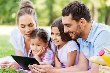 Image showing family with tablet pc on picnic in summer park