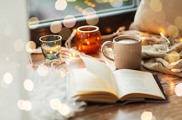 Image showing book and coffee or hot cchocolate on window sill