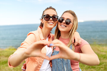 Image showing teenage girls or best friends at seaside in summer