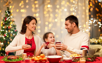 Image showing happy family having christmas dinner at home