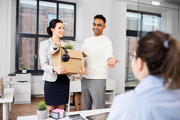 Image showing new female employee meeting colleagues at office