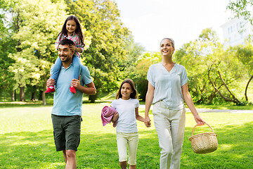 Image showing family with picnic basket walking in summer park