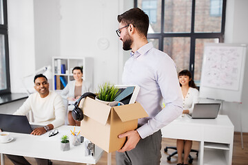 Image showing happy male office worker with personal stuff