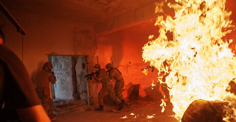 Image showing Videographer Taking Action Shoot of Soldiers in Action urban environment