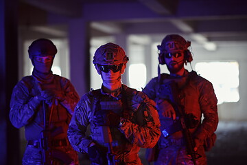 Image showing soldier squad team portrait in urban environment colored lightis