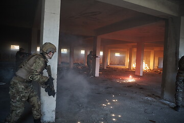 Image showing military troops in action urban environment