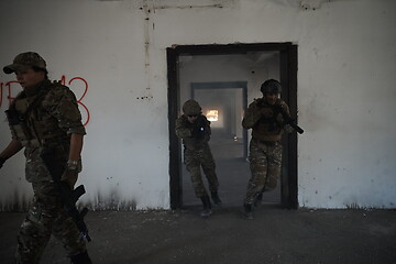 Image showing military troops in action urban environment