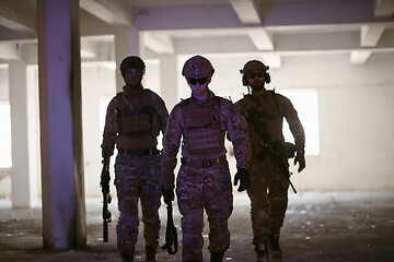 Image showing soldier squad team portrait in urban environment colored lightis