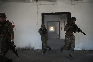 Image showing military troops in action urban environment