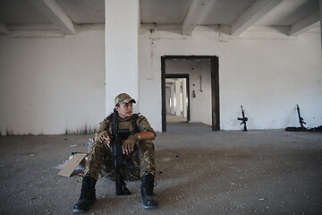 Image showing military female soldier having a break