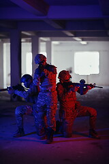 Image showing Soldiers squad in tactical formation having action urban environment