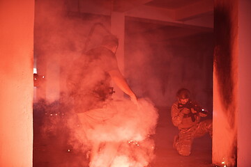 Image showing military troops in action urban environment