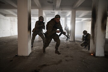 Image showing military troops in action urban environment