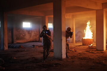 Image showing military troops in action urban environment