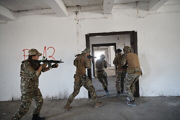 Image showing military troops in action urban environment