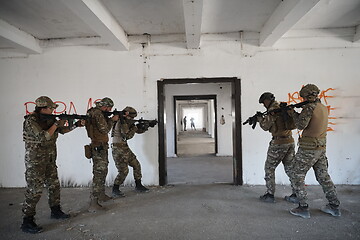 Image showing military troops in action urban environment