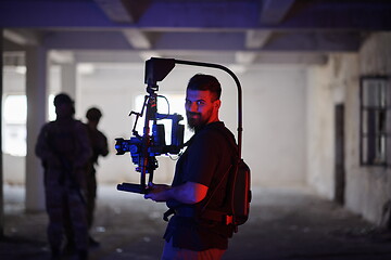 Image showing Videographer Taking Action Shoot of Soldiers in Action urban environment