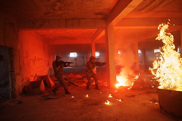 Image showing military troops in action urban environment